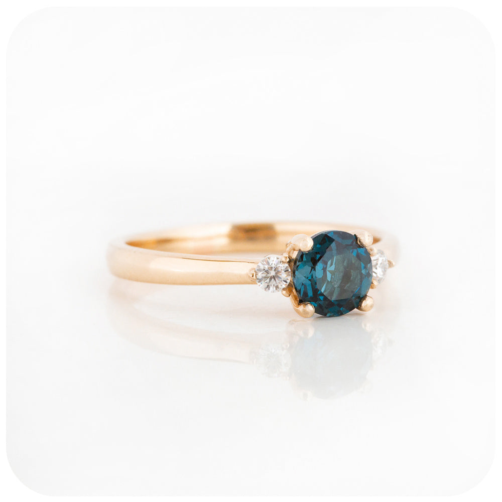 teal london blue topaz and moissanite trilogy style enagement ring in rose gold - Victoria's Jewellery