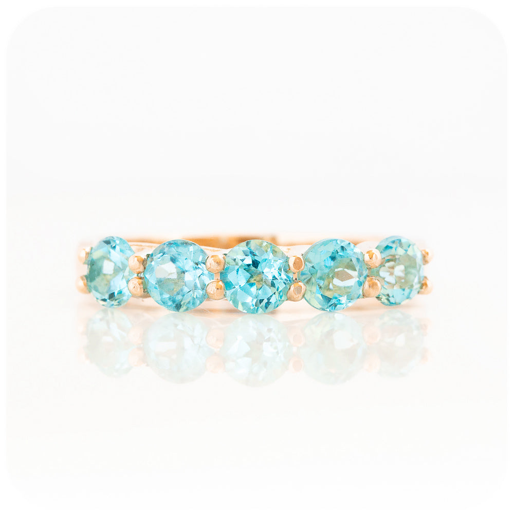 Danelle, a Swiss Blue Topaz Half Eternity Trellis Ring