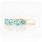 Danelle, a Swiss Blue Topaz Half Eternity Trellis Ring