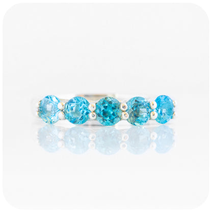 Danelle, a Swiss Blue Topaz Half Eternity Trellis Ring