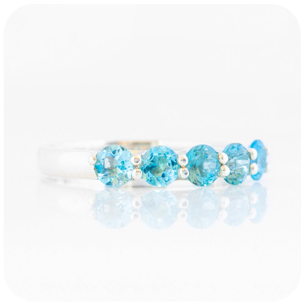 Danelle, a Swiss Blue Topaz Half Eternity Trellis Ring