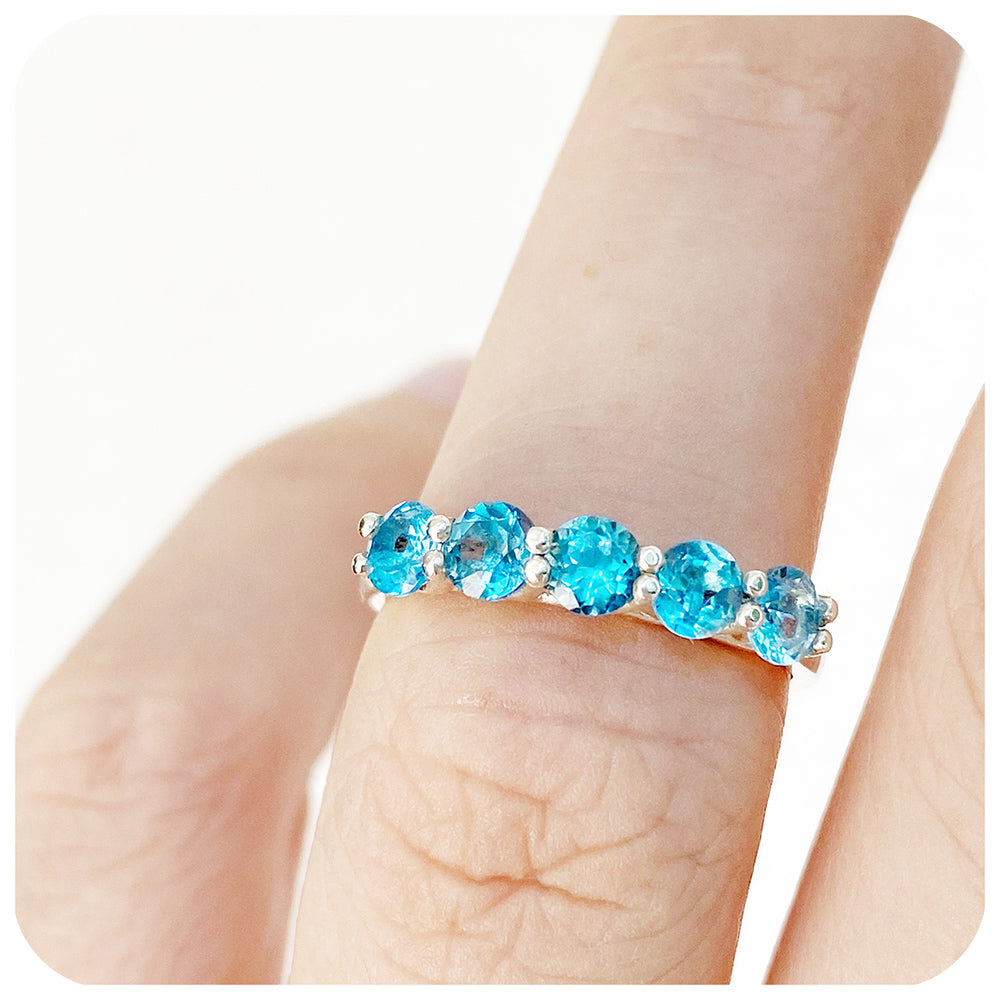 The Danelle, a Swiss Blue Topaz Half Eternity Trellis Ring