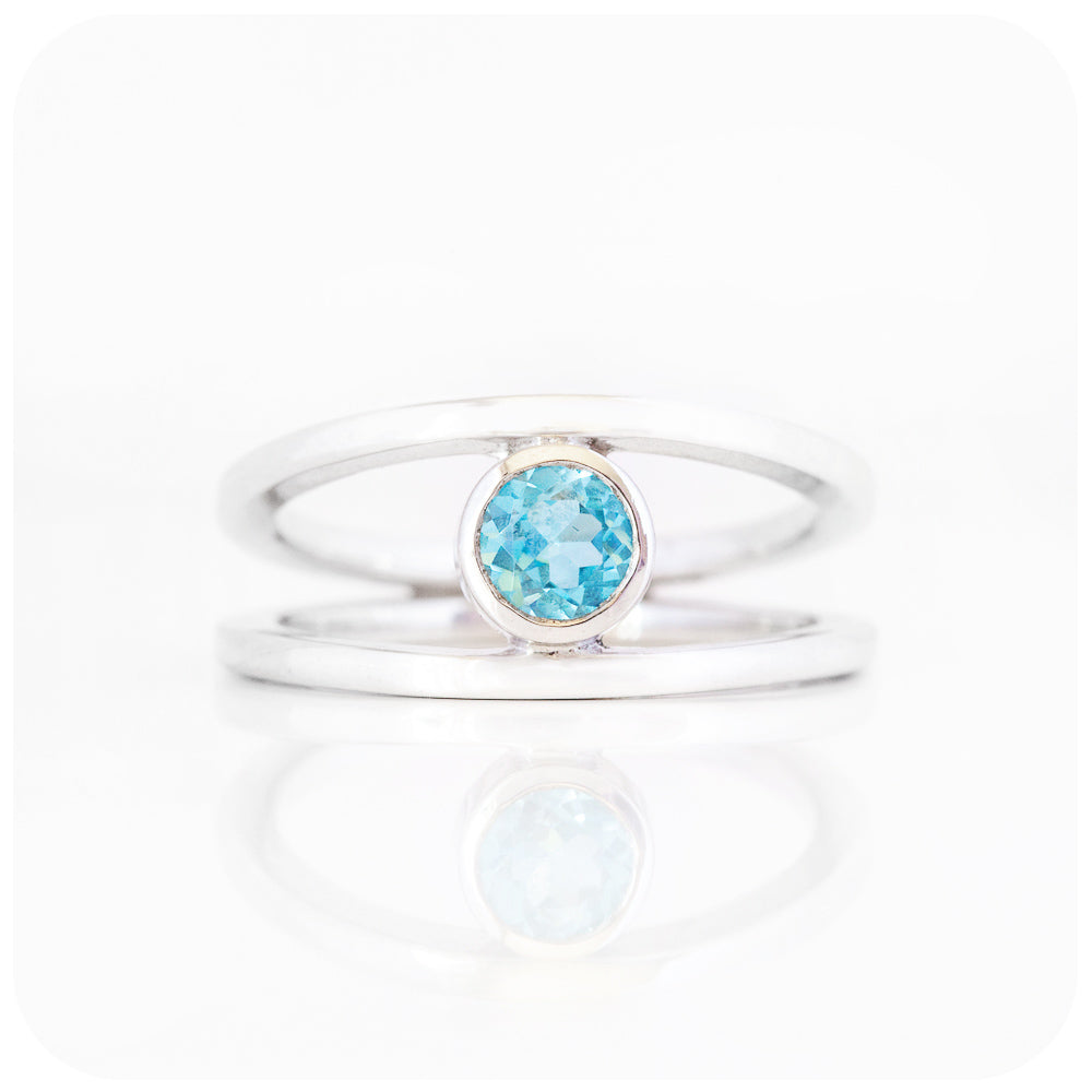 Round cut Swiss Blue Topaz Ring with a Split Band Design in Sterling Silver