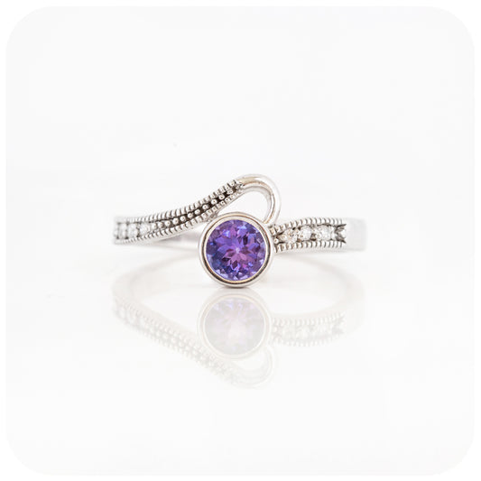 Round cut Tanzanite and Cubic Zirconia Ring in Sterling Silver