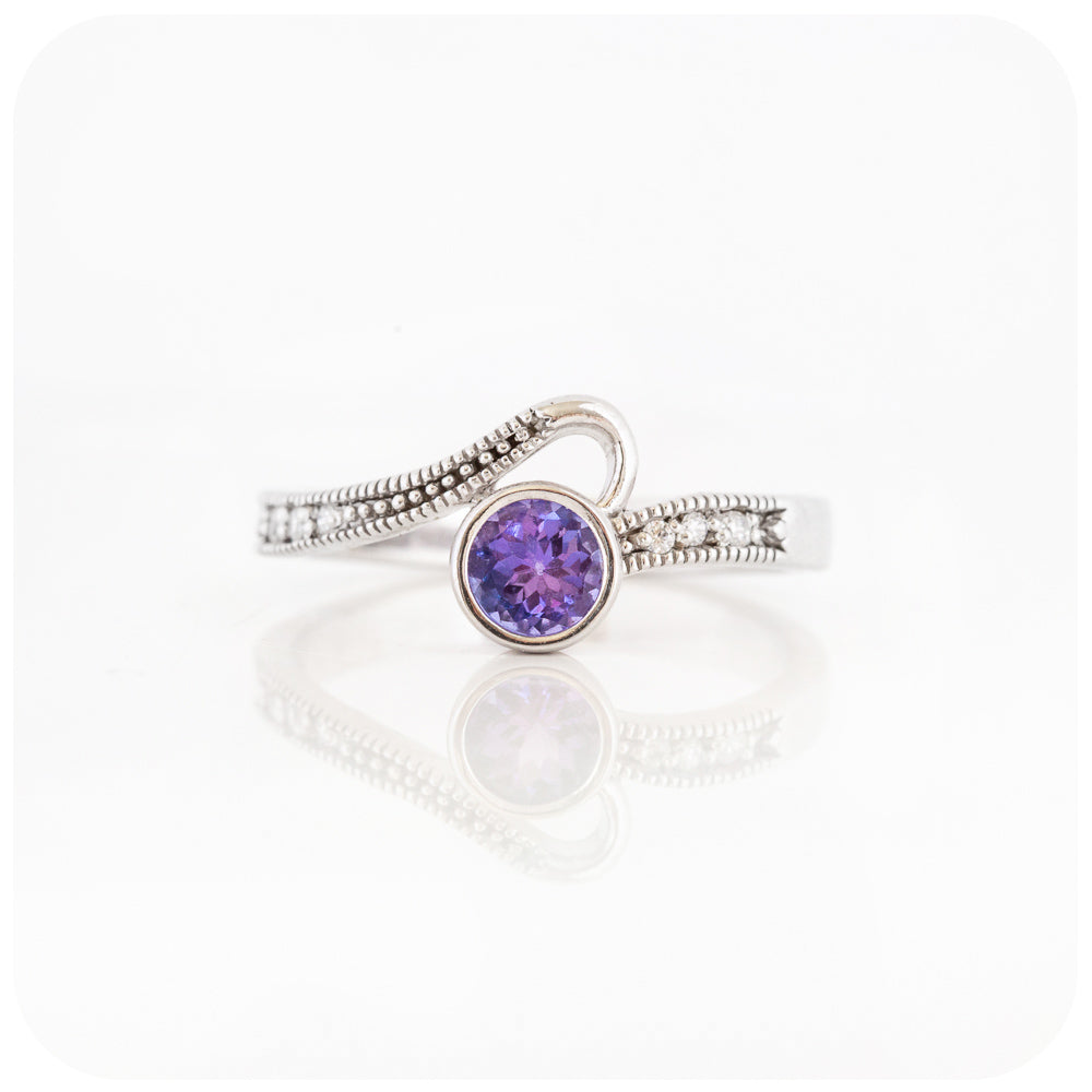 Round cut tanzanite and cubic zirconia dress ring