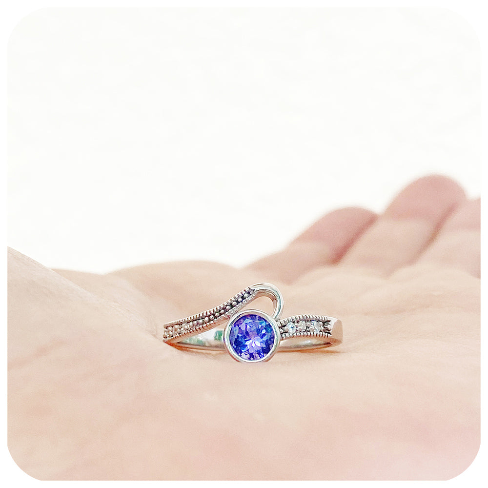 Round cut tanzanite and cubic zirconia dress ring