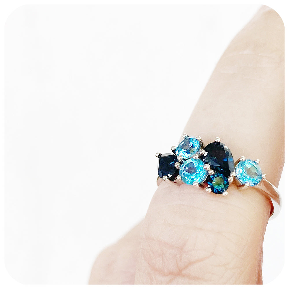 The Ena, a Cluster Ring with London and Swiss Blue Topaz