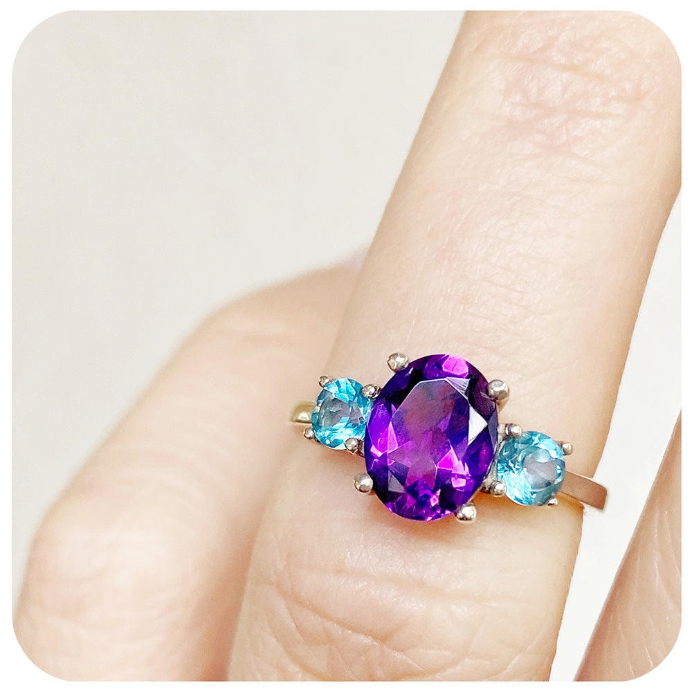 Oval cut Amethyst and Blue Topaz Trilogy Anniversary Ring - Victoria's Jewellery