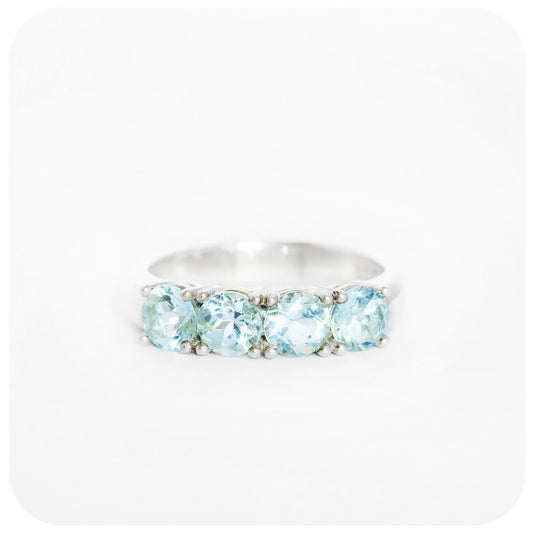 The Aquamarine Four Stone Half Eternity Ring in Sterling Silver