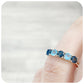 brilliant cut blue topaz half eternity anniversary or birthstone ring