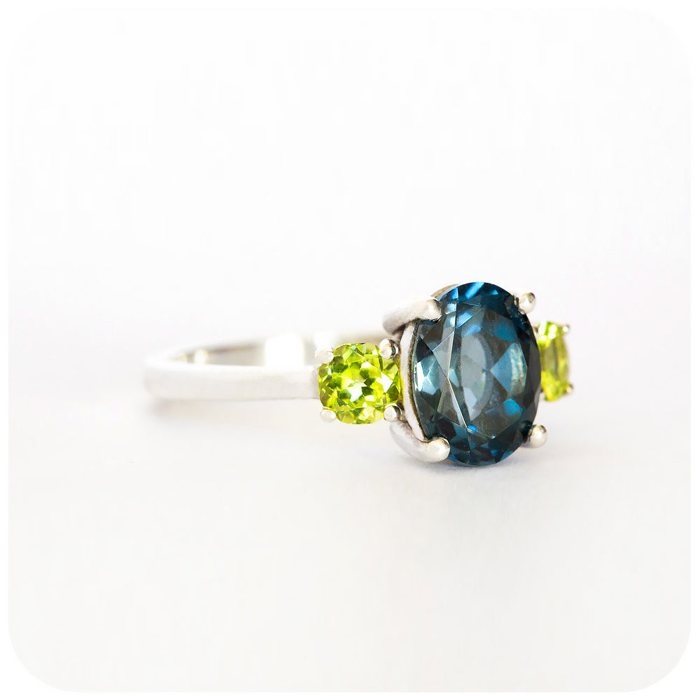 London Blue Topaz and Peridot Trilogy Ring in Sterling Silver - 9x7mm