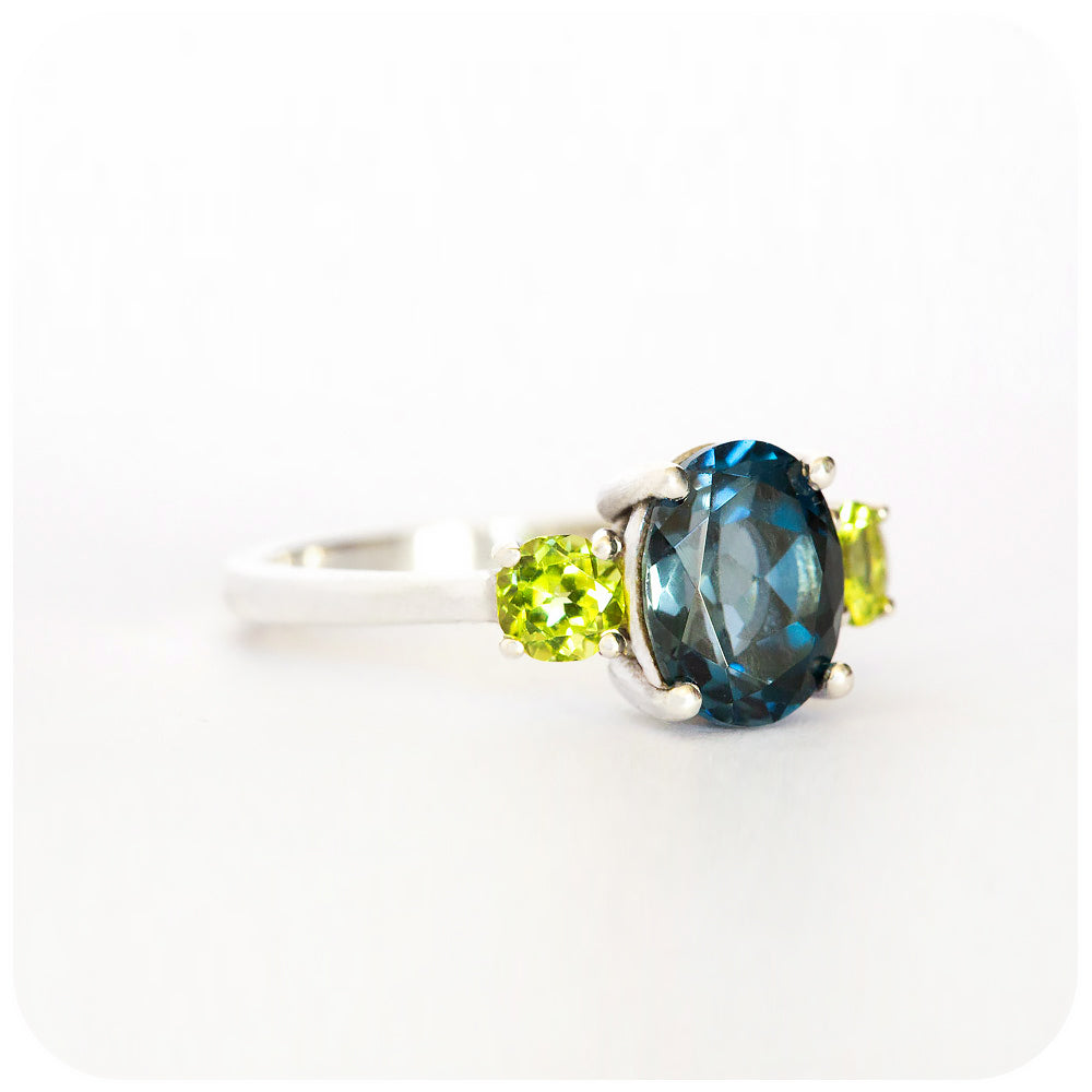 Oval cut London Blue Topaz and Peridot Trilogy Anniversary Ring - Victoria's Jewellery