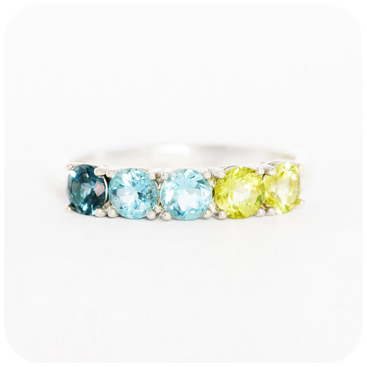Annie, a Topaz and Peridot Half Eternity Ring