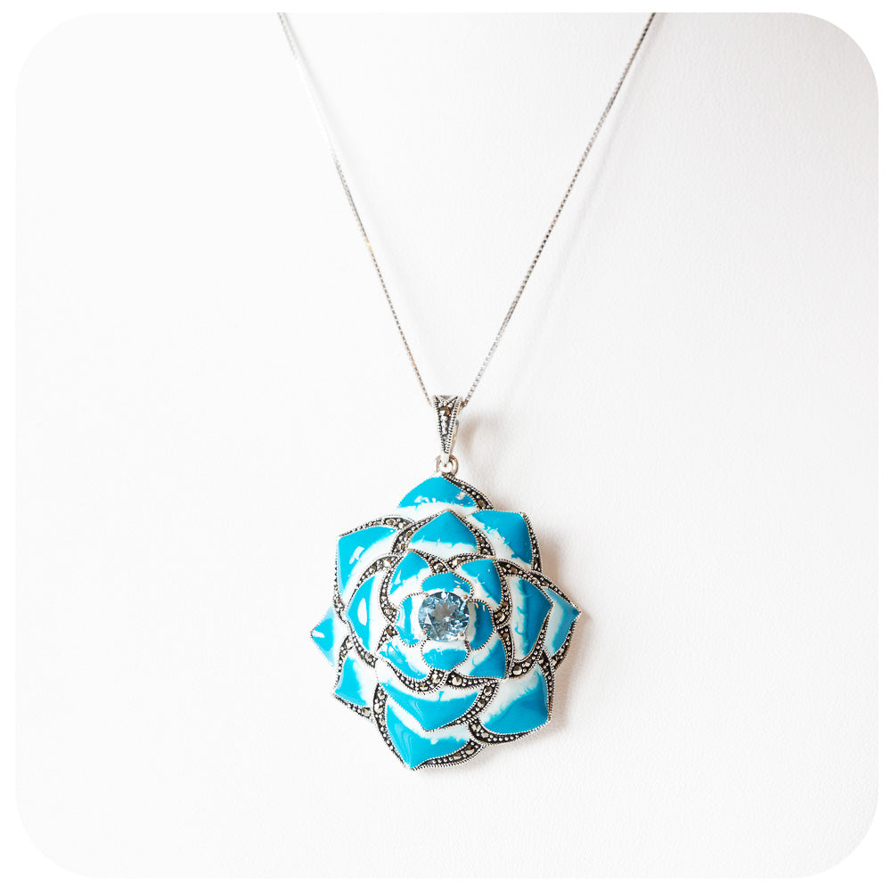 Blue Enamel and Blue Topaz Flower Pendant in Sterling Silver