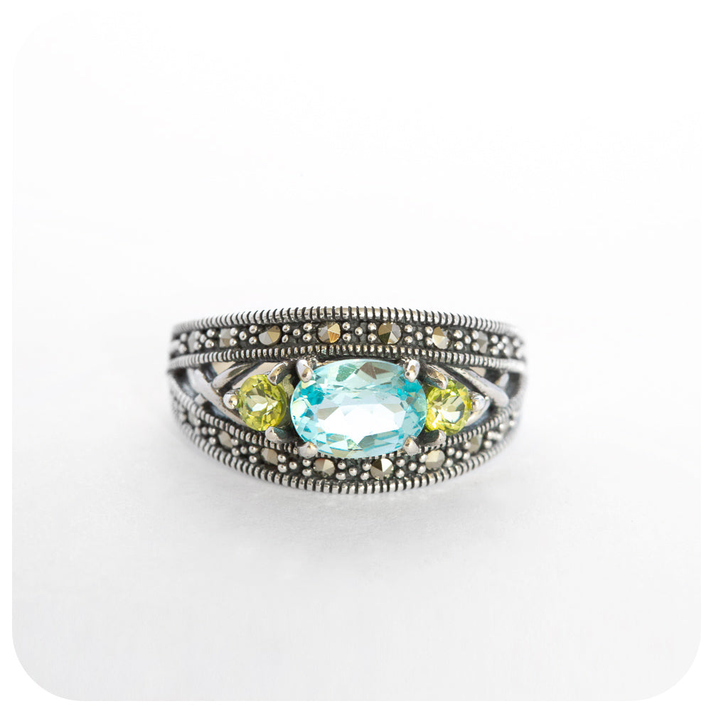 peridot and blue topaz vintage style trilogy ring