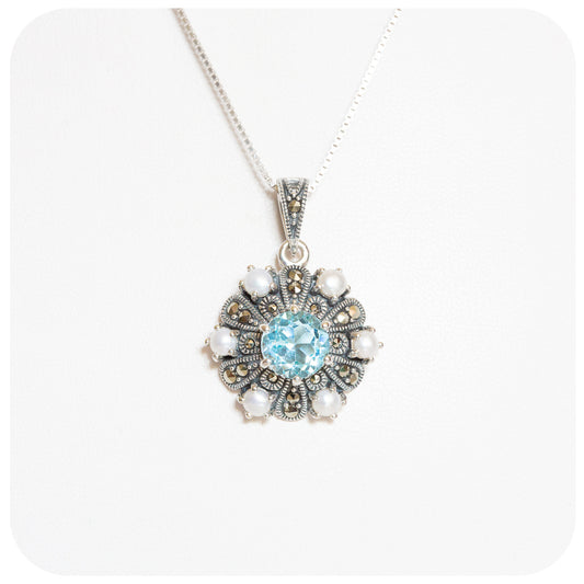 Vintage Inspired Blue Topaz and Fresh Water Pearl Pendant and Chain in Sterling Silver