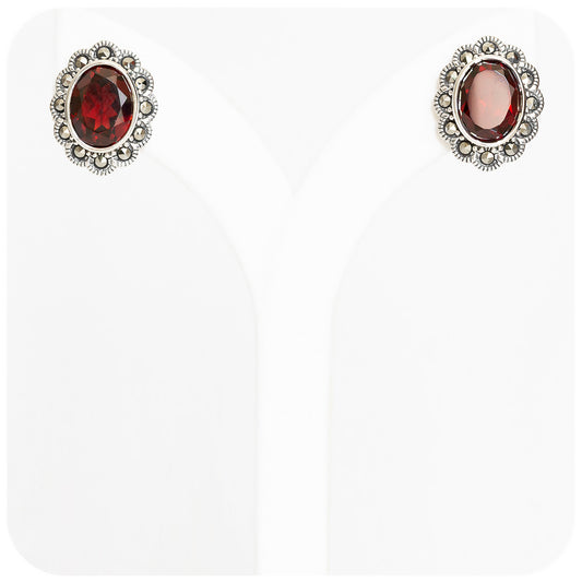 oval red garnet january birthstone stud earrings in a vintage halo sterling silver setting