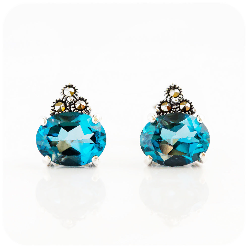oval cut london blue topaz stud earrings in sterling silver