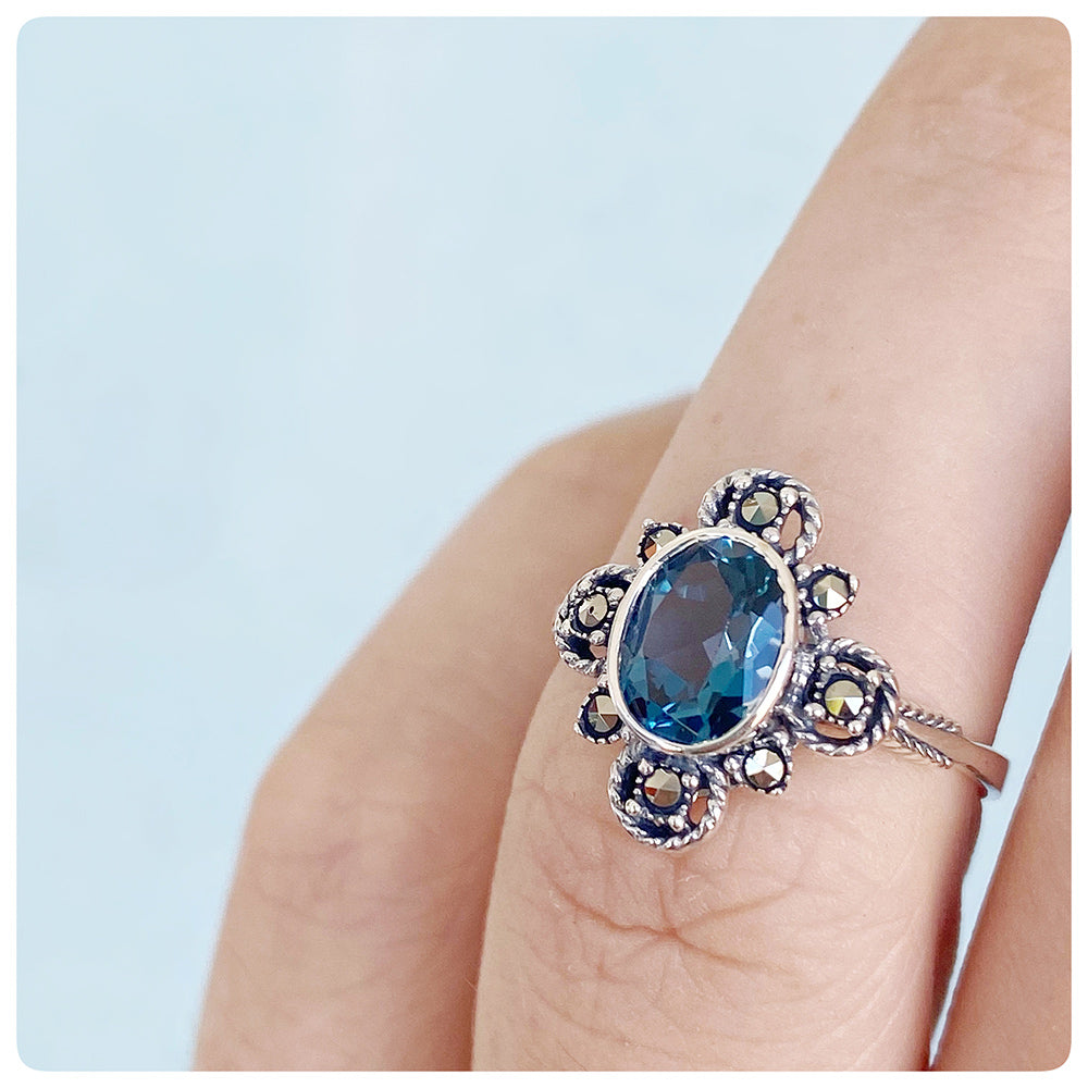 Oval cut London Blue Topaz and Marcasite Flower Ring in Sterling Silver