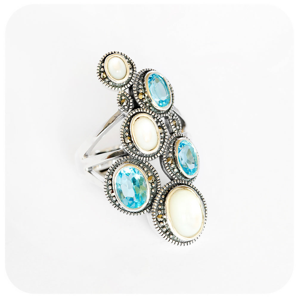 Oval cut Blue Topaz and Mother of Pearl ring in sterling silver - Victoria's Jewellery