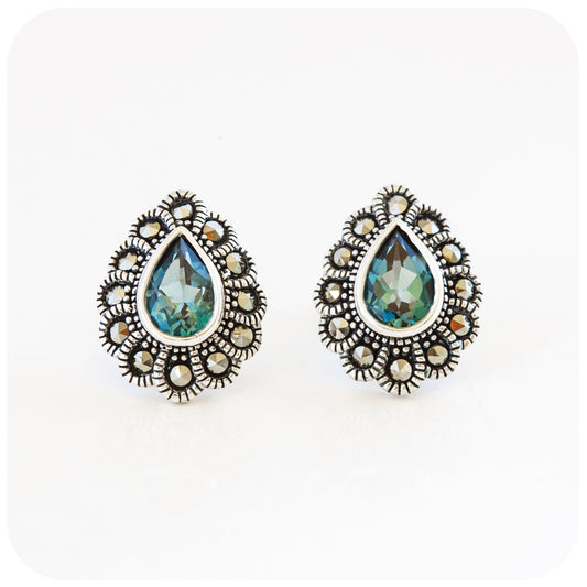 pear cut teal london blue topaz stud earrings with a vintage halo in sterling silver