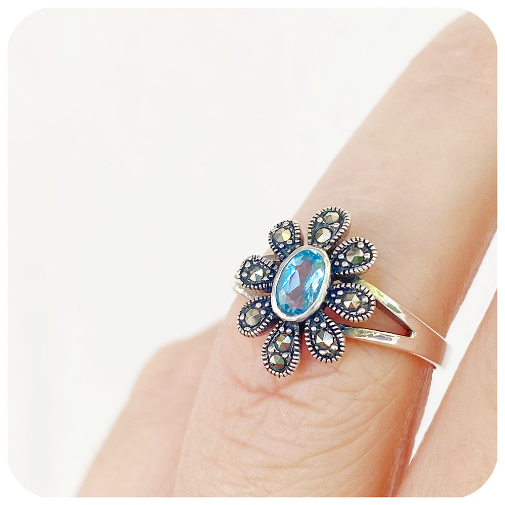 Oval cut Swiss Blue Topaz and Marcasite Flower Ring in Sterling Silver
