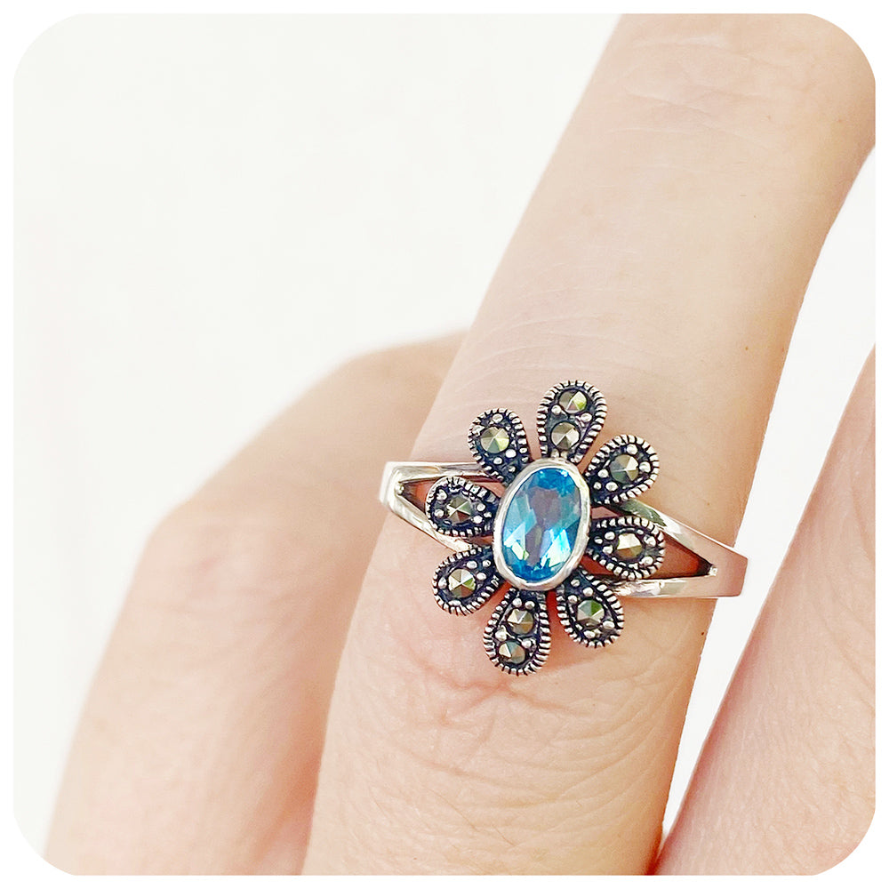 Oval cut Swiss Blue Topaz and Marcasite Flower Ring in Sterling Silver