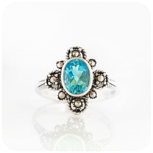 oval cut blue topaz ring in a vintage rope design setting