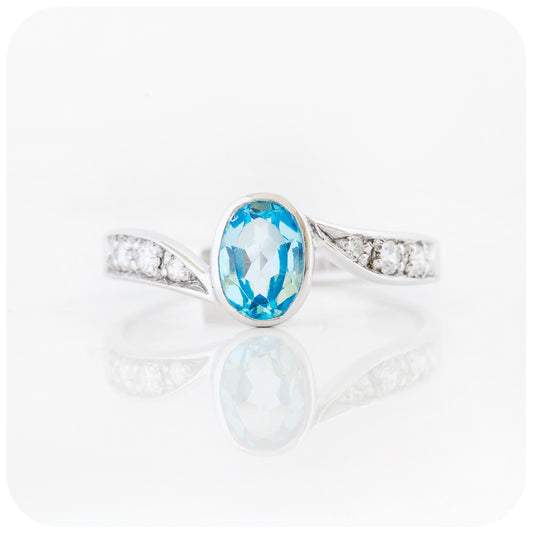 oval cut swiss blue topaz and cubic zirconia twisted ring in sterling silver