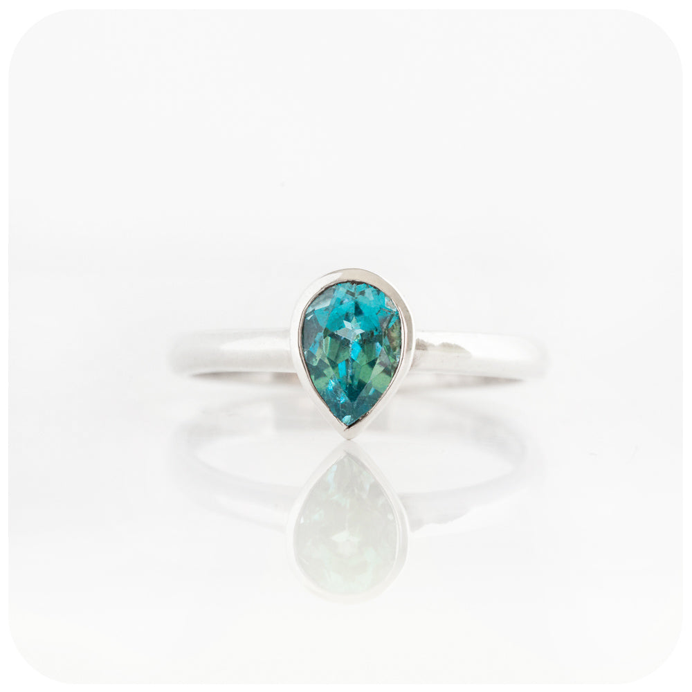 Pear cut Swiss Blue Topaz Solitaire Ring in Sterling Silver
