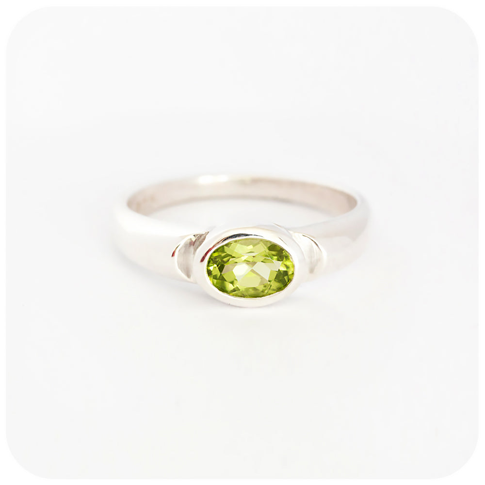 Oval cut Peridot Solitaire Ring in Sterling Silver
