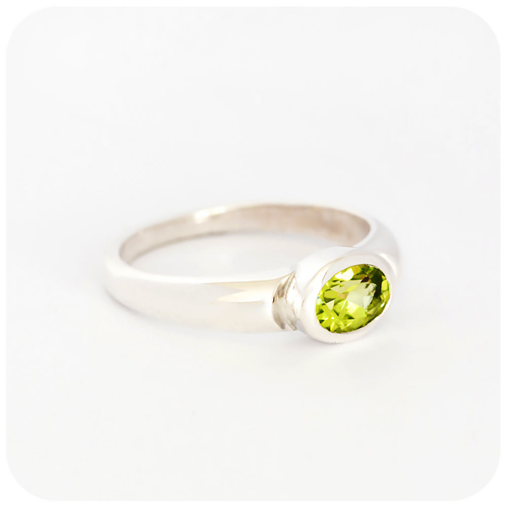 Oval cut Peridot Solitaire Ring in Sterling Silver