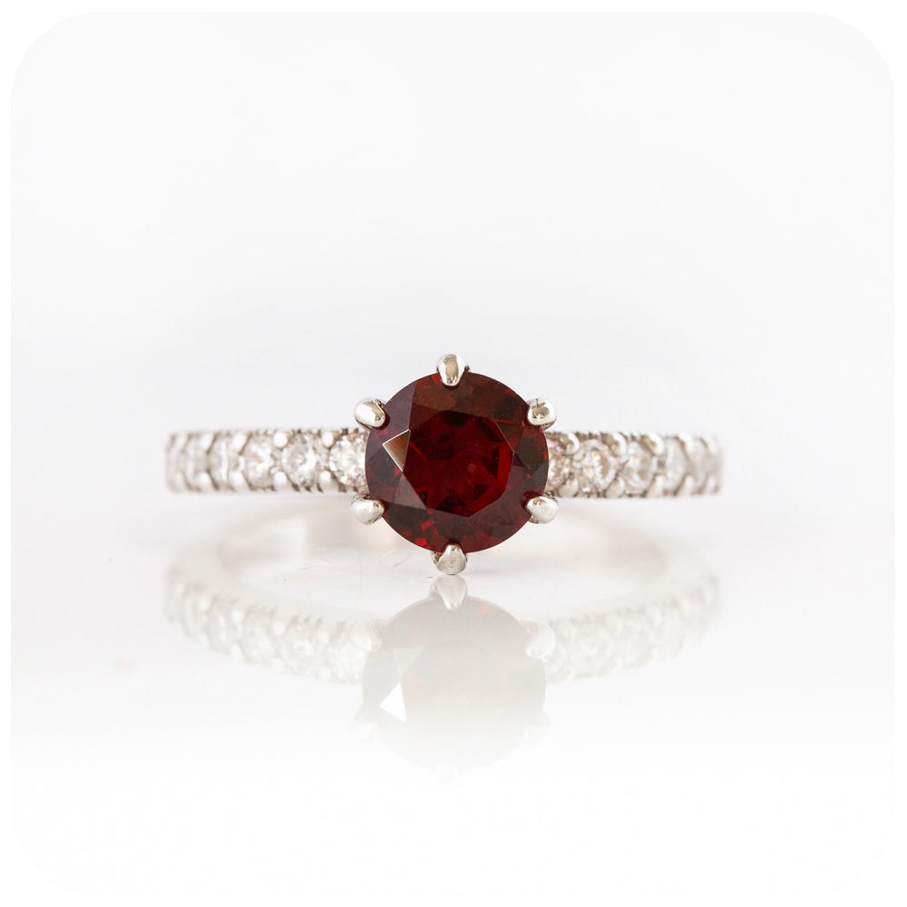 brilliant cut garnet and cubic accent engagement ring