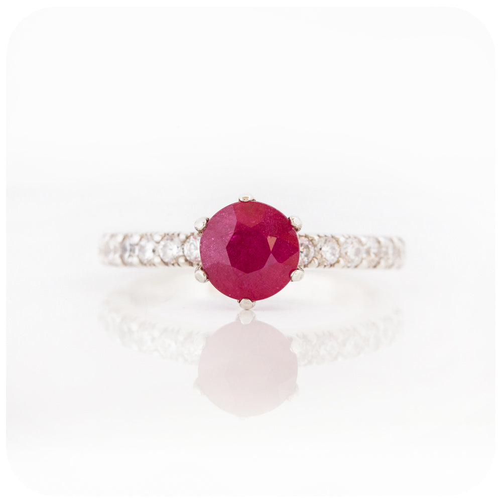 brilliant cut ruby and cubic accent engagement ring