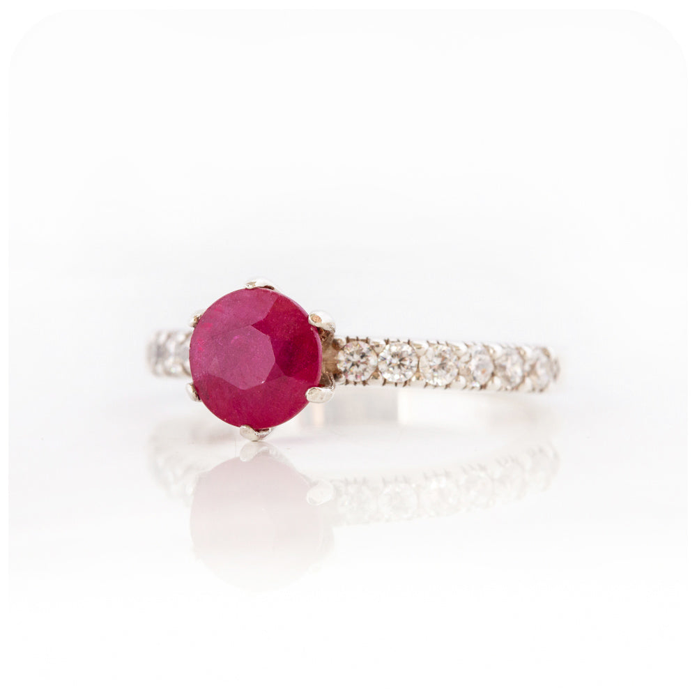 brilliant cut ruby and cubic accent engagement ring