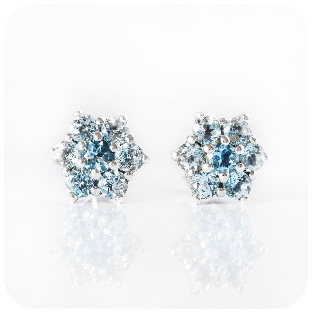 Sky Blue Topaz Flower Stud Earrings in Sterling Silver