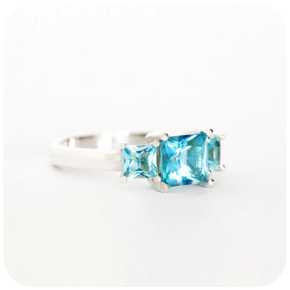 Princess cut Swiss Blue Topaz Trilogy Ring in Sterling Silver