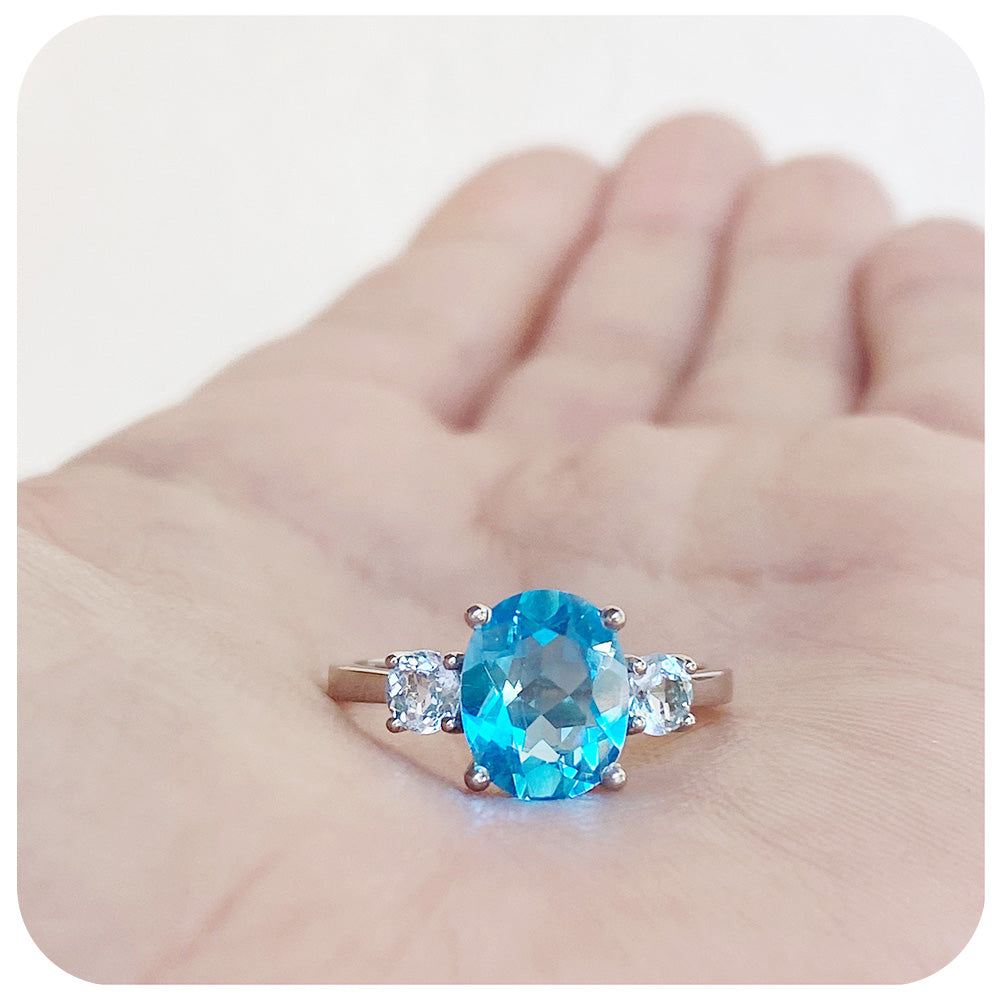 Oval cut Swiss Blue Topaz and Sky Blue Topaz Trilogy Anniversary Ring - Victoria's Jewellery