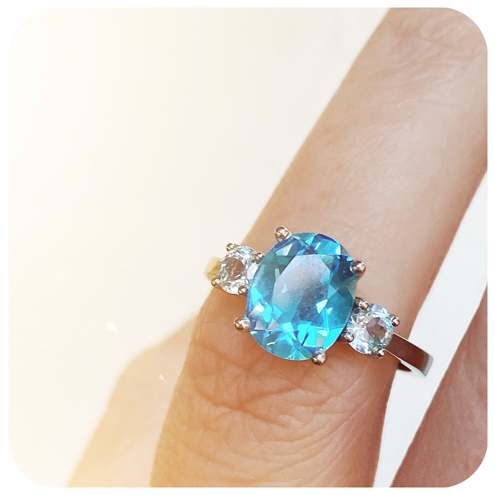 Oval cut Swiss Blue Topaz and Sky Blue Topaz Trilogy Anniversary Ring - Victoria's Jewellery