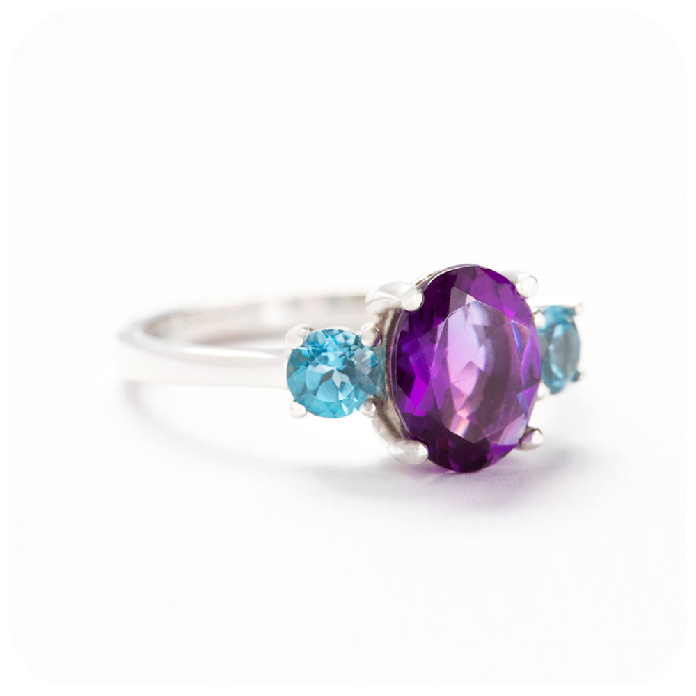 Oval cut Amethyst and Blue Topaz Trilogy Anniversary Ring - Victoria's Jewellery