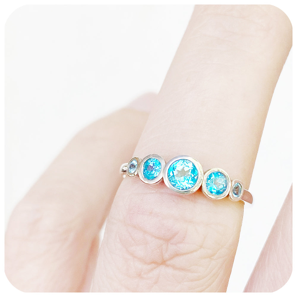 Gabriella, a Swiss Blue Topaz Half Eternity Ring
