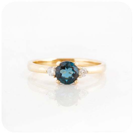 teal london blue topaz and moissanite trilogy style enagement ring in yellow gold - Victoria's Jewellery